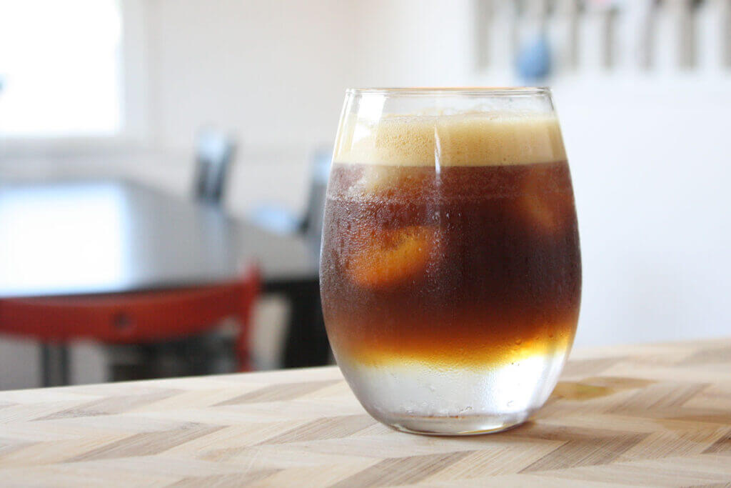 Tonic and Espresso on a wood table