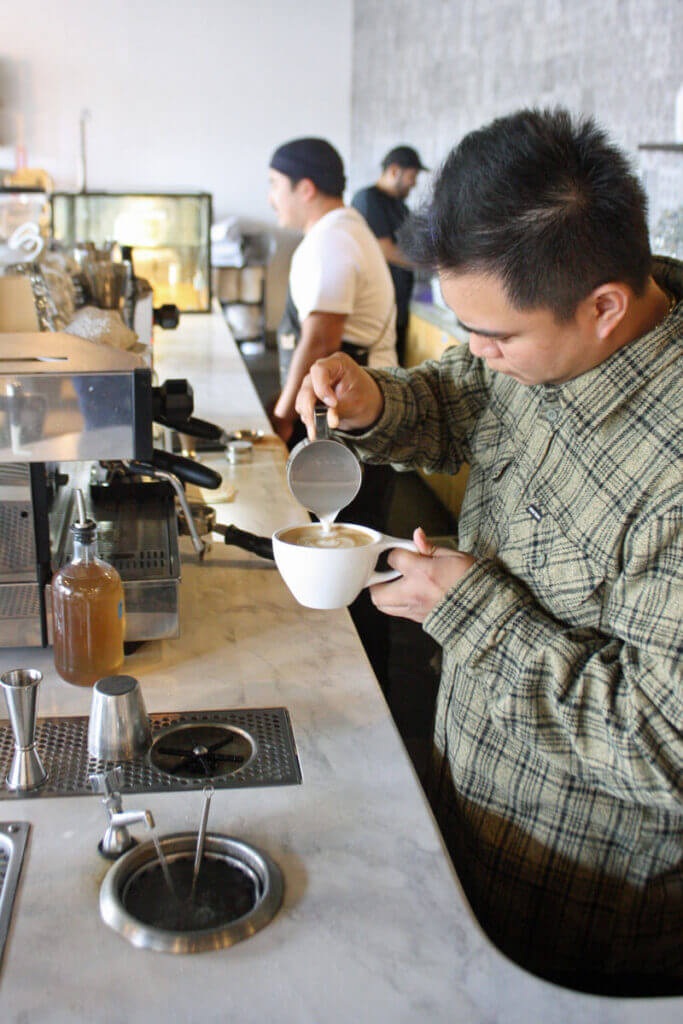 Matthew making a latte