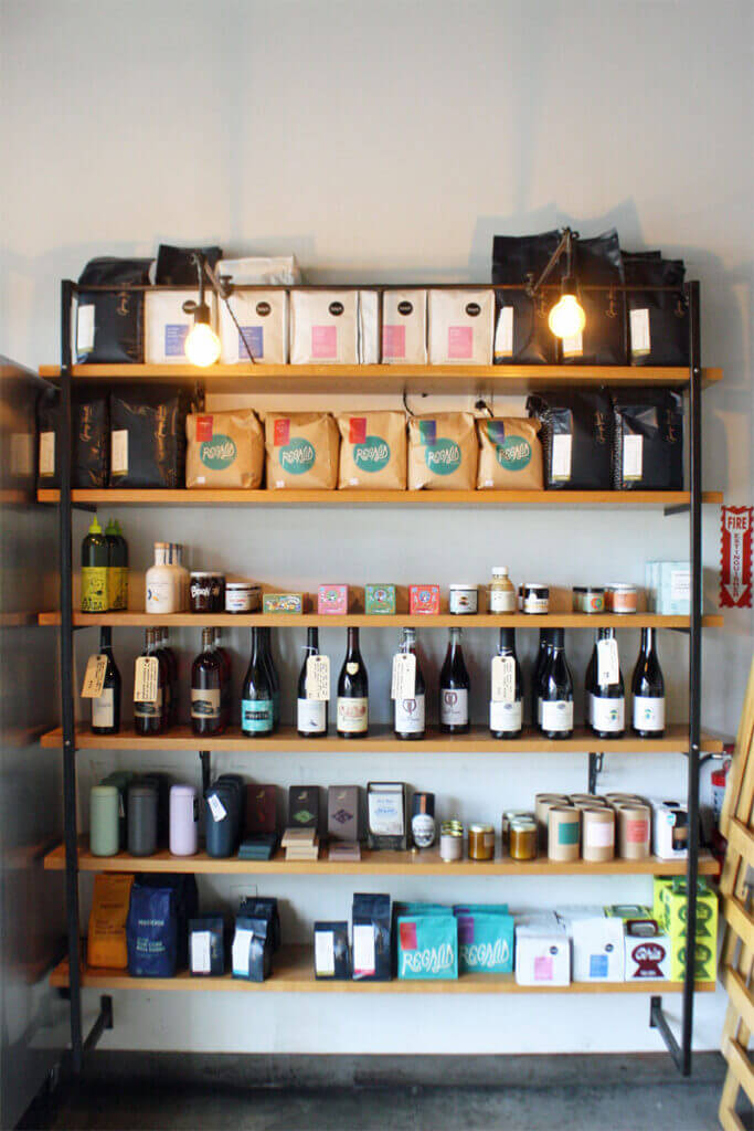 A shelf with coffee and wine offerings